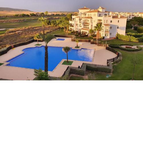 2 bedr apt with pool and lovely terrace overlooking the golf resort!