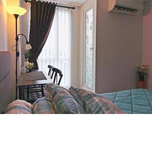 A Peaceful Room at Barsacity Apartment by Ciputra