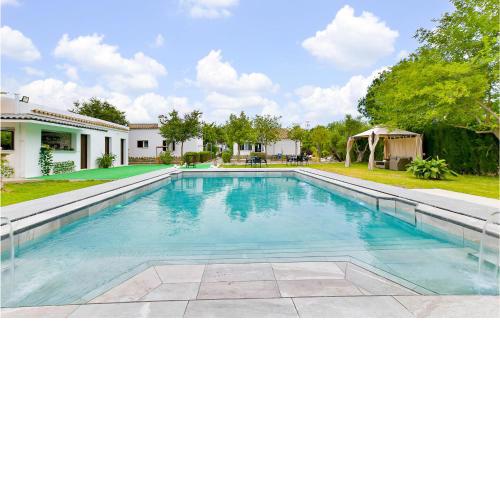 Amazing home in El Coronil with Outdoor swimming pool, WiFi and 2 Bedrooms