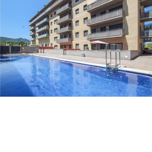 Awesome apartment in Sant Carles de la Ràpi with Outdoor swimming pool, WiFi and 2 Bedrooms