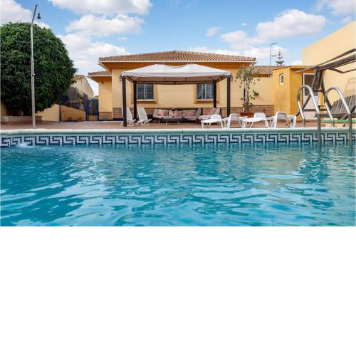 Awesome home in El Portil with Outdoor swimming pool, WiFi and 4 Bedrooms
