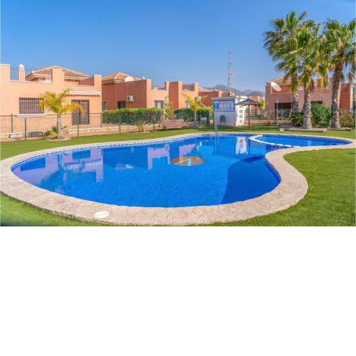Awesome home in Isla Plana with Outdoor swimming pool, WiFi and 2 Bedrooms
