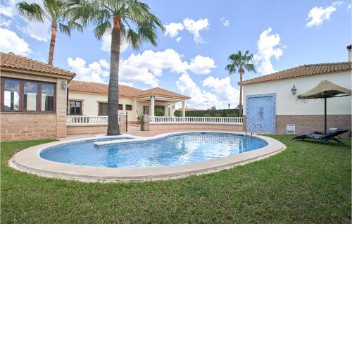 Awesome home in La Carlota with Outdoor swimming pool, WiFi and 4 Bedrooms