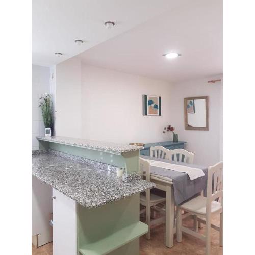 Beachfront apartment with a private garden and barbecue