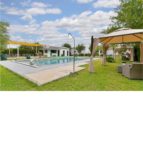 Beautiful home in El Coronil with Outdoor swimming pool, WiFi and 8 Bedrooms