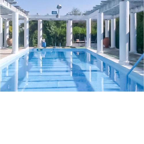 Beautiful home in Gines with Outdoor swimming pool and 4 Bedrooms