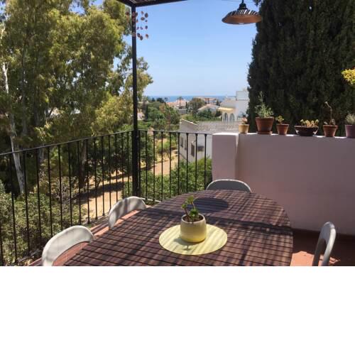 Casa con terraza y vistas al mar