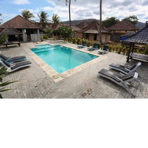 Collection O 1651 Purnama Beach Hotel