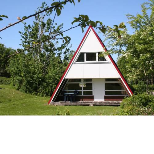 Detached holiday home, decorated with wood, on the Ostsee