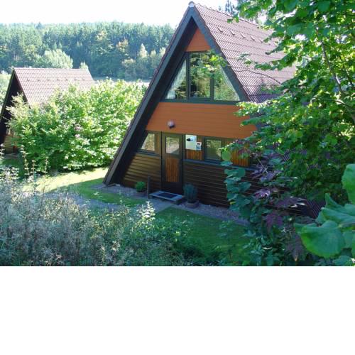 Detached, wooden bungalow with a terrace, in a wooded area
