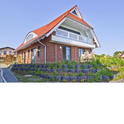 Ferienhaus Zaunkönig FeWo EG Terrasse und Garten, etwas Meerblick