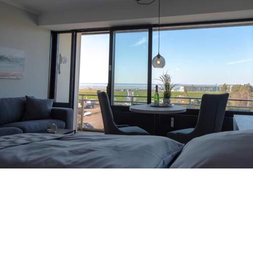 Fewo 304 mit Meerblick und Strandkorb im Haus Jan am Strand in Döse