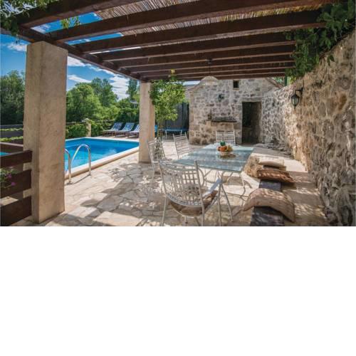 Four-Bedroom Holiday home Zmijavci with a Fireplace 09