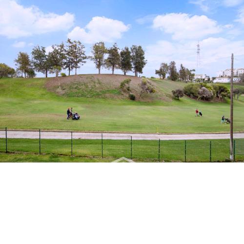 Frontline golf apartment in Riviera del Sol with interior and exterior pools and tennis court!