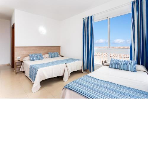 Habitacion triple sin cocina, con piscina, Wifi y Vista cerca de Playa Jardin en Puerto de la Cruz