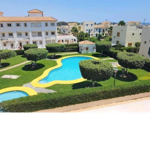 Holiday property with terrace, access to textile swimming pool and beach front