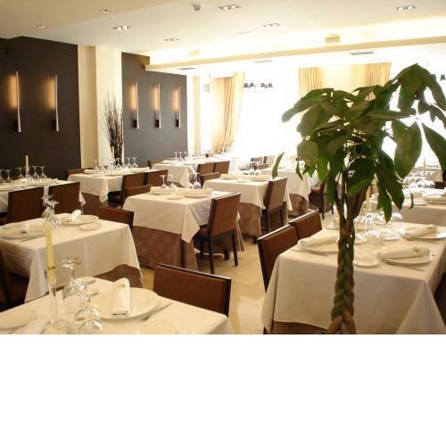 Hotel Asador H.M. Versus