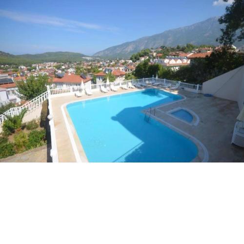 House with communal pool in hisaronu bar street
