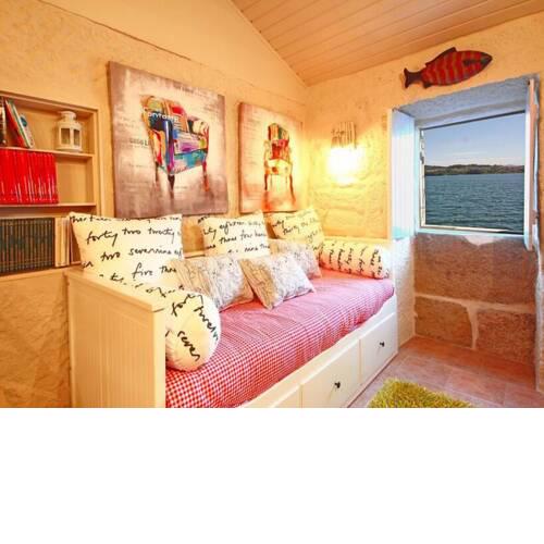 House with history and old salt warehouse hanging over the sea