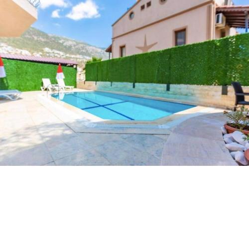 Kalkan merkezde 2 kişilik ortak havuzlu daire