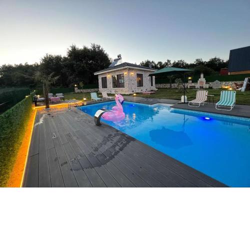 MedaSuite stone house with detached pool