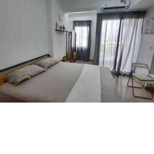 Minimalist room at The Nest Apartment by Popobella Near Puri Indah West Jakarta