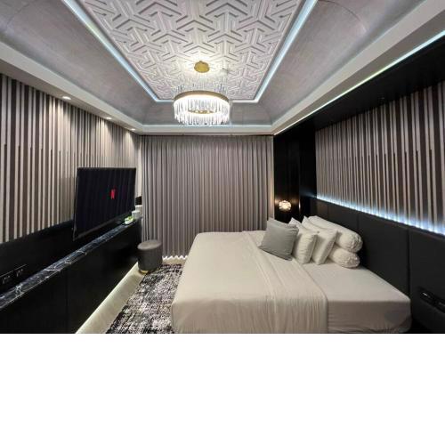 Monochromic Studio Apartment by Kinasih Suites