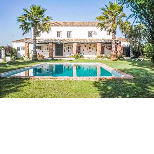 Nice home in Coria del Río with Outdoor swimming pool and 4 Bedrooms