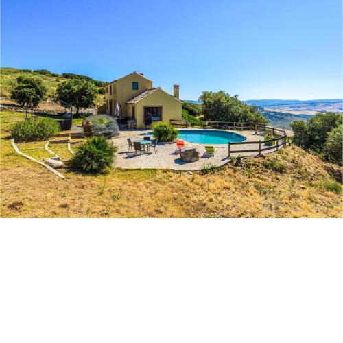 Nice home in El Gastor with Outdoor swimming pool, WiFi and 6 Bedrooms