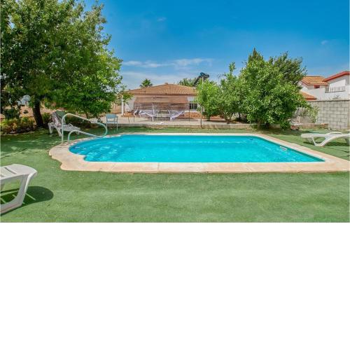 Nice home in La Carlota with Outdoor swimming pool, WiFi and 4 Bedrooms