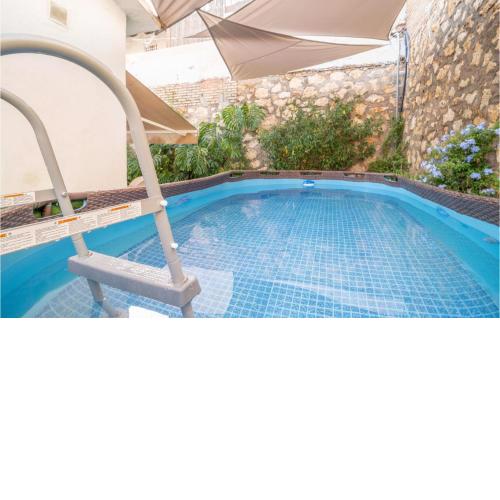 Nice home in Rincon de la Victoria with Outdoor swimming pool, WiFi and 3 Bedrooms
