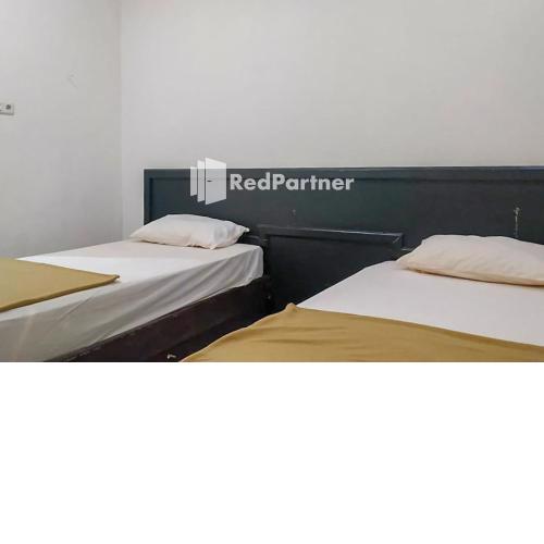 Palu City Guest House RedPartner