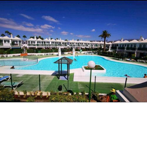 Poolside duplex in secure gated complex