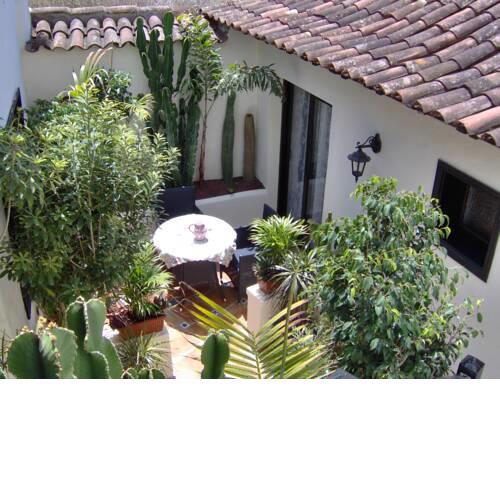 Rustic apartment with small patio-terrace