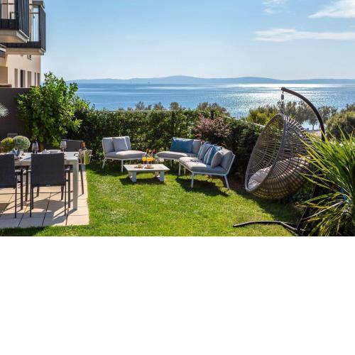 Sea front Luxury apartment with a PRIVATE infinity POOL , a large garden and a private garage on the beach in Split