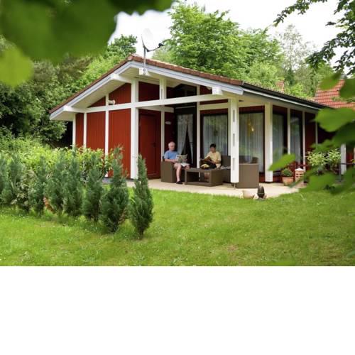 Single storey detached bungalow, located in a wooded area