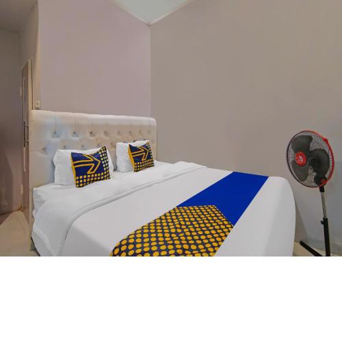 SPOT ON 92570 Putri Guest House Syariah
