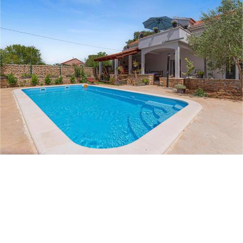 Stunning home in Oklaj with Outdoor swimming pool, WiFi and 3 Bedrooms