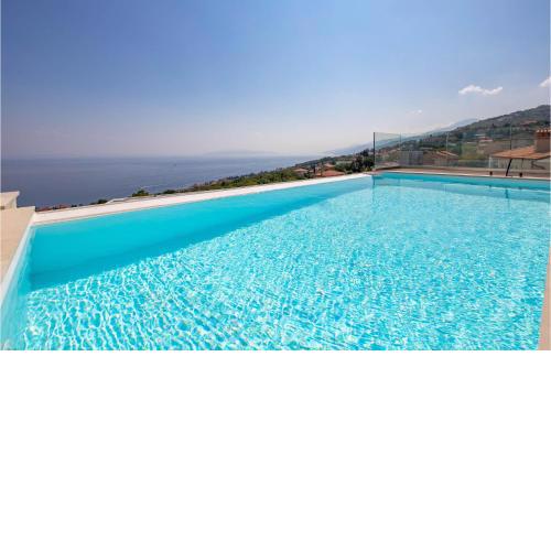 Stunning home in Pobri with Outdoor swimming pool and 4 Bedrooms