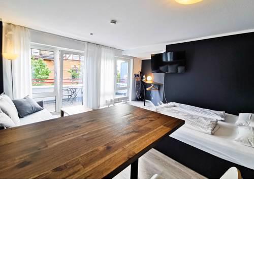 stylish studio - main train station close to city centre - netflix - balcony - parking
