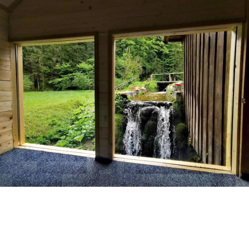 Wooden house with a waterfall "Stipanov mlin"